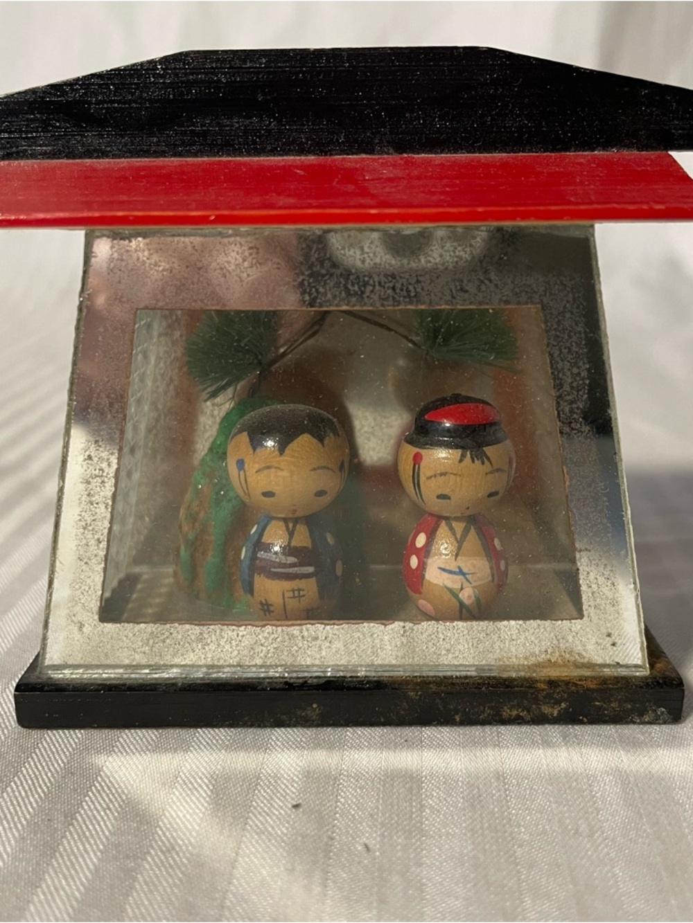 A vintage miniature Japanese Kokeshi doll diorama